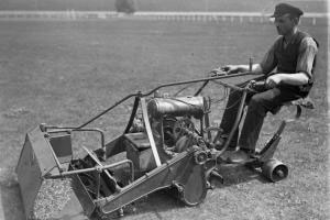 An antique ride-on mower from around 1930